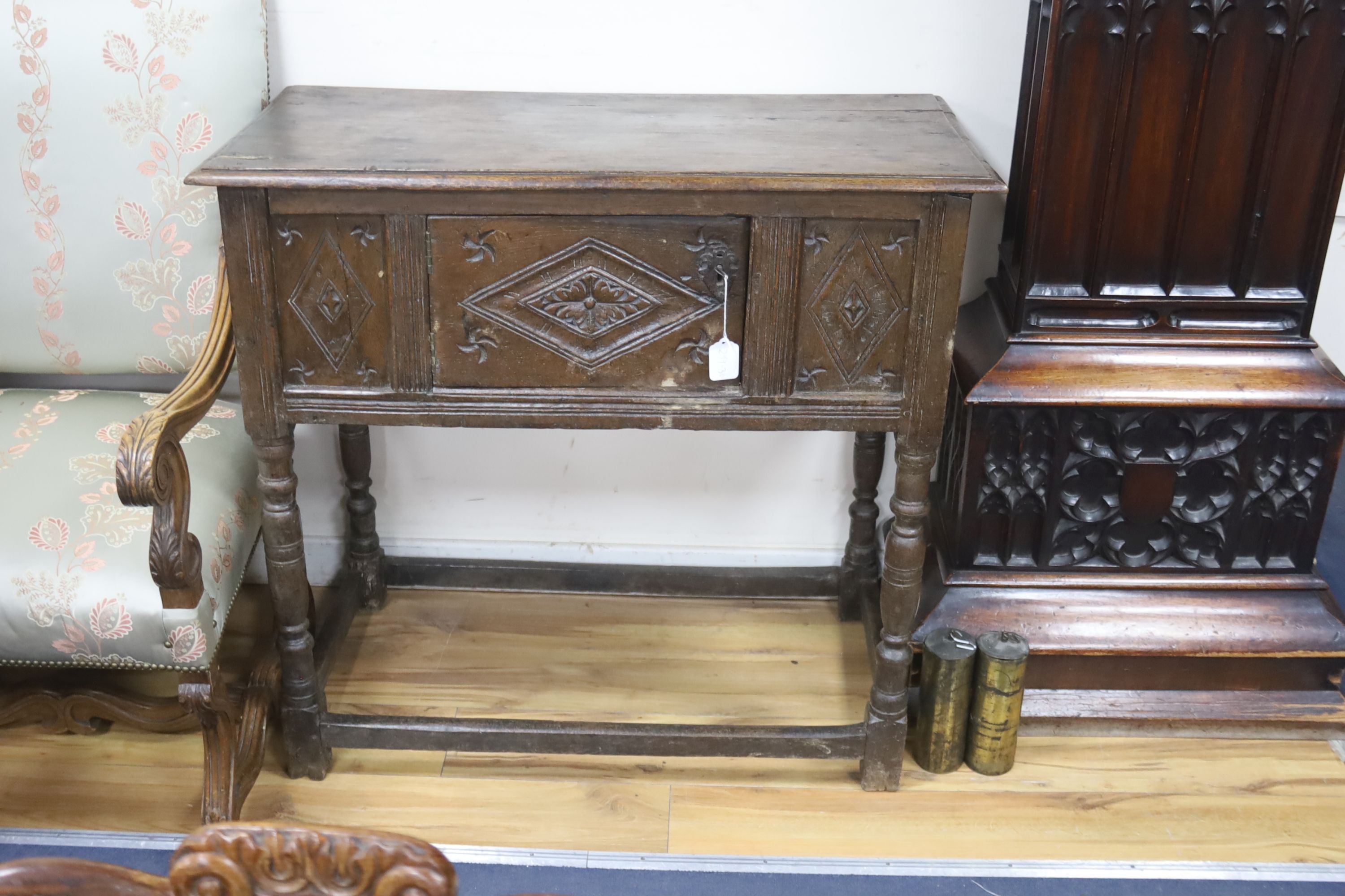 A 17th century panelled oak side cupboard, length 97cm, depth 48cm, height 91cm